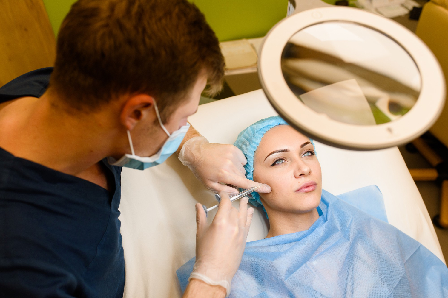 expert injector performing cheek filler with micro cannula at reveal clinics riyadh