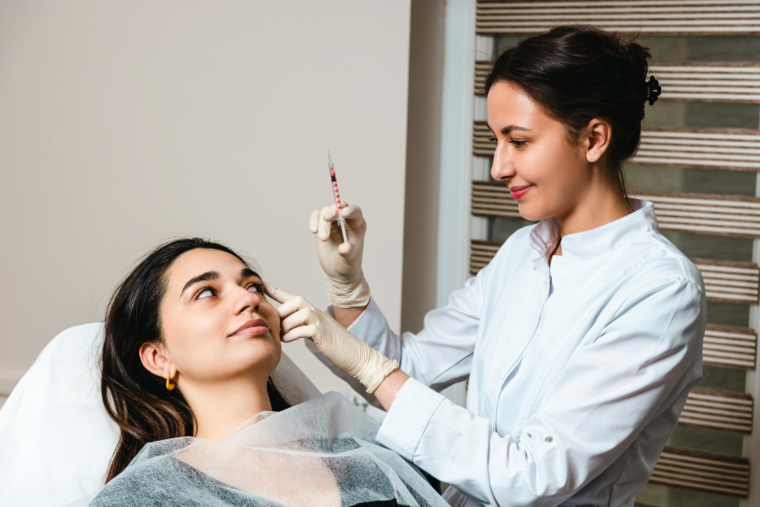 dermatologist performing preventive botox micro dosing on young adult in riyadh