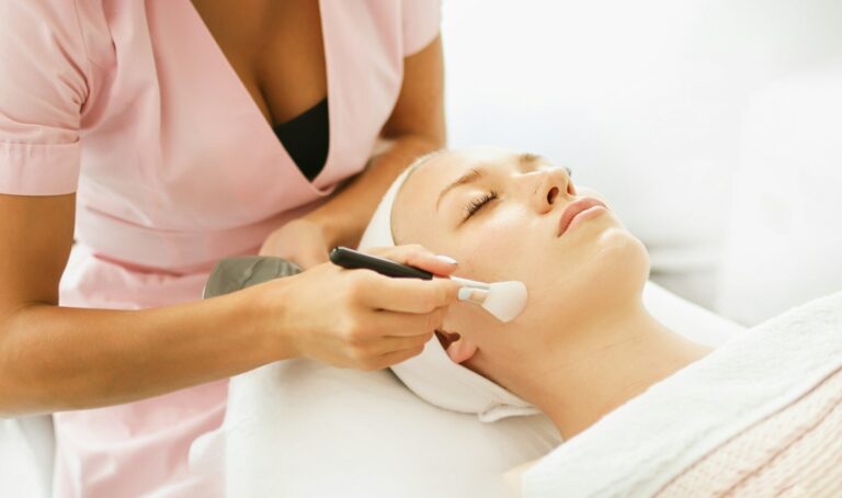 beautician-cosmetologist-applies-cosmetic-product-gel-peeling-mask-with-spatula.jpg